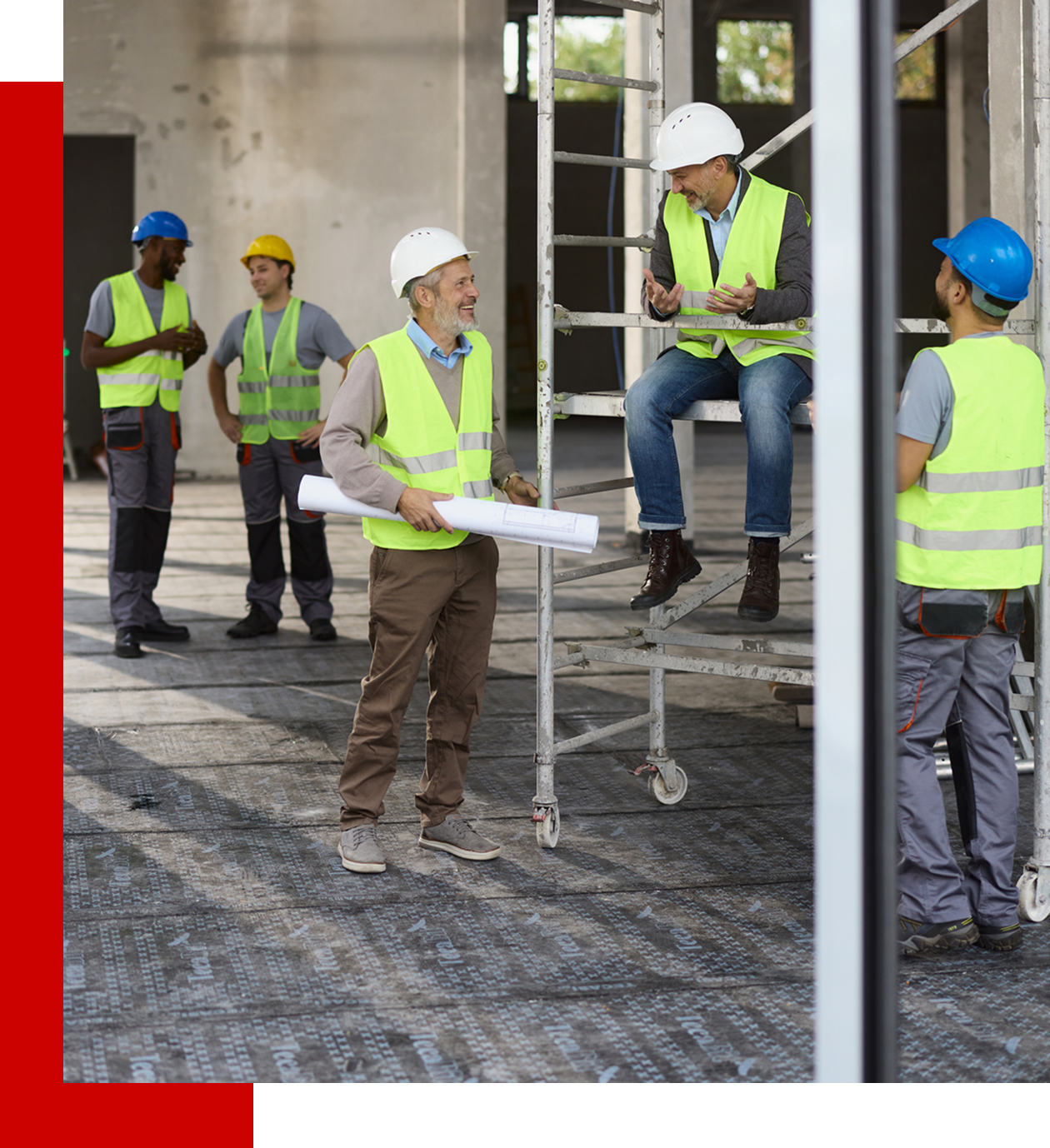 Construction workers discussing plans on site